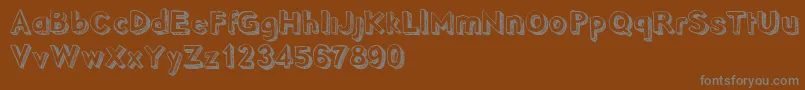 PointyDemo Font – Gray Fonts on Brown Background