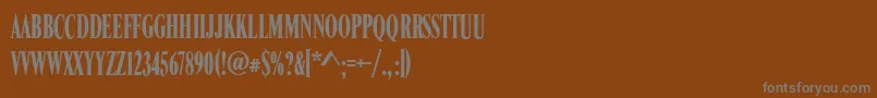 RomanCompressedRegular-fontti – harmaat kirjasimet ruskealla taustalla