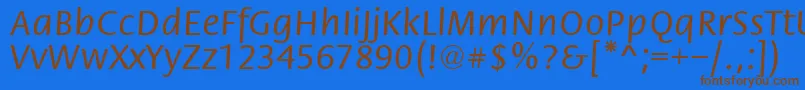 フォントFloriRegular – 茶色の文字が青い背景にあります。