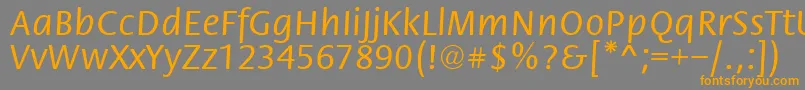 フォントFloriRegular – オレンジの文字は灰色の背景にあります。