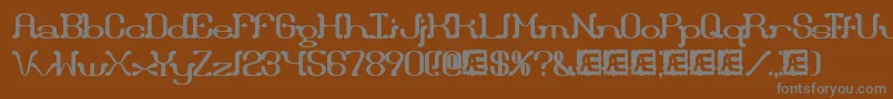 フォントDraggleBrk – 茶色の背景に灰色の文字