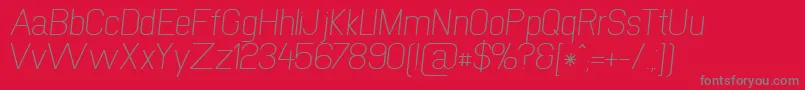 NewmediaRegularItalic-Schriftart – Graue Schriften auf rotem Hintergrund
