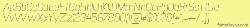 NewmediaRegularItalic Font – Gray Fonts on Yellow Background