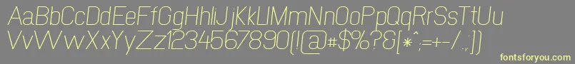 NewmediaRegularItalic Font – Yellow Fonts on Gray Background