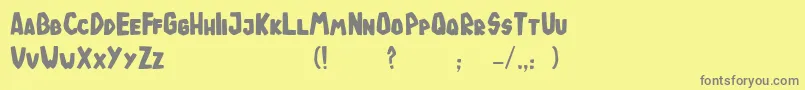 フォントTodeJaOigus – 黄色の背景に灰色の文字