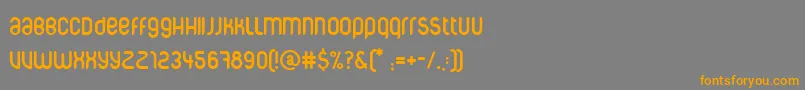 フォントCorpuscare – オレンジの文字は灰色の背景にあります。