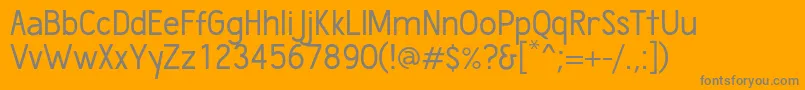 WumbologyBook-Schriftart – Graue Schriften auf orangefarbenem Hintergrund