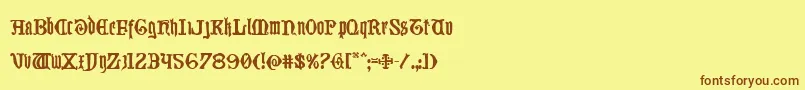 フォントWestdelphia – 茶色の文字が黄色の背景にあります。