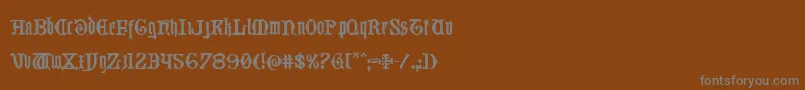 Westdelphia-fontti – harmaat kirjasimet ruskealla taustalla