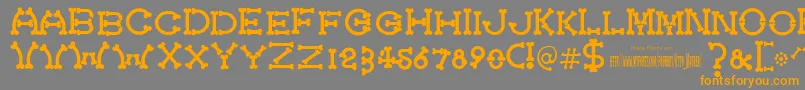 フォントBonecracker – オレンジの文字は灰色の背景にあります。