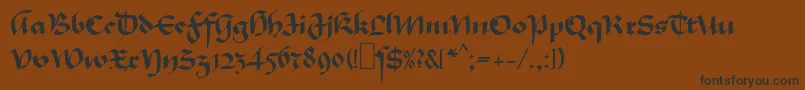 Fonte MaGkursiv1 – fontes pretas em um fundo marrom