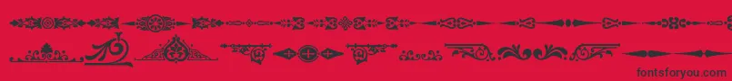 フォントOrnamenttm2 – 赤い背景に黒い文字