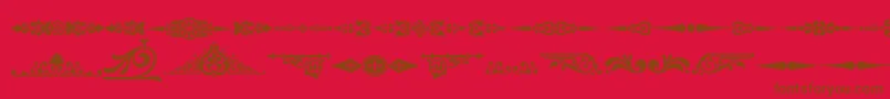 Ornamenttm2-fontti – ruskeat fontit punaisella taustalla