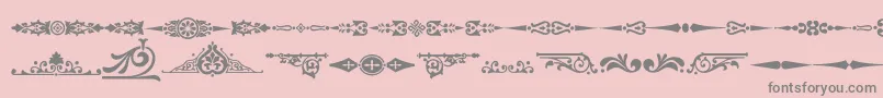 En savoir plus sur la police Ornamenttm2 Police Ornamenttm2 – polices grises sur fond rose