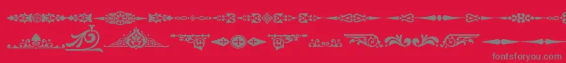 フォントOrnamenttm2 – 赤い背景に灰色の文字