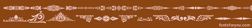 Czcionka Ornamenttm2 – różowe czcionki na brązowym tle