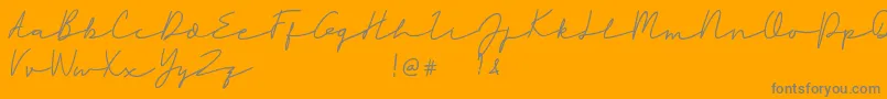 Rahayu-Schriftart – Graue Schriften auf orangefarbenem Hintergrund