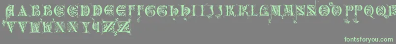 Incunitials Font – Green Fonts on Gray Background