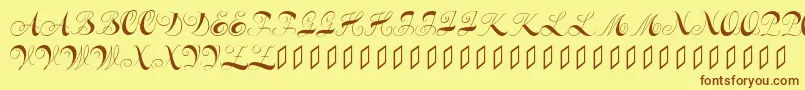 フォントConstanzeinitials – 茶色の文字が黄色の背景にあります。
