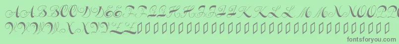 フォントConstanzeinitials – 緑の背景に灰色の文字