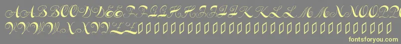 Шрифт Constanzeinitials – жёлтые шрифты на сером фоне