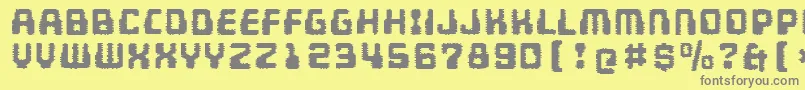フォントMultivacInterference – 黄色の背景に灰色の文字