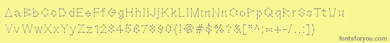 Blocknation-fontti – harmaat kirjasimet keltaisella taustalla