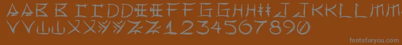 フォントYonezawa – 茶色の背景に灰色の文字