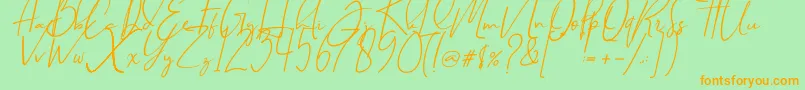 フォントBrilliantSignature1Slant – オレンジの文字が緑の背景にあります。