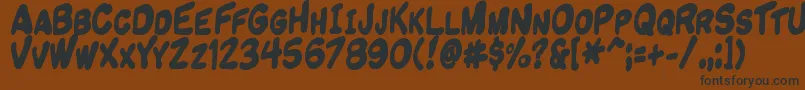 Komikandy Font – Black Fonts on Brown Background