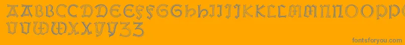 Weissgotnitials-Schriftart – Graue Schriften auf orangefarbenem Hintergrund