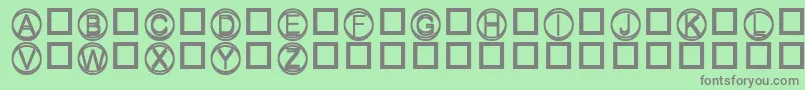 Knapp-fontti – harmaat kirjasimet vihreällä taustalla