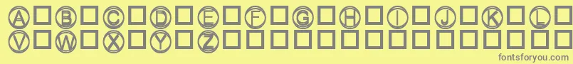 Knapp-fontti – harmaat kirjasimet keltaisella taustalla