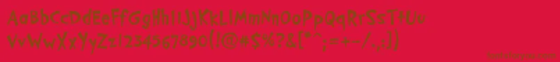 PfcosmonutproBold-Schriftart – Braune Schriften auf rotem Hintergrund