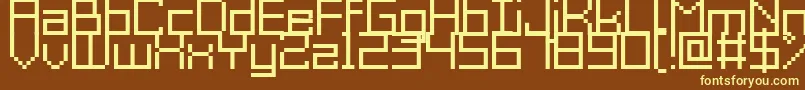 GrixelAcme9Regular-fontti – keltaiset fontit ruskealla taustalla