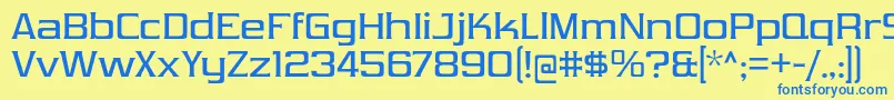 フォントVibrocentricRg – 青い文字が黄色の背景にあります。