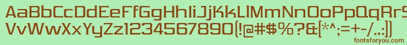 フォントVibrocentricRg – 緑の背景に茶色のフォント