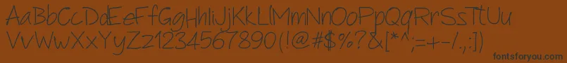 Pwanotherscript-Schriftart – Schwarze Schriften auf braunem Hintergrund