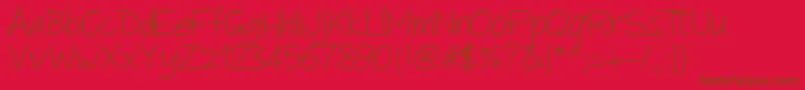 Czcionka Pwanotherscript – brązowe czcionki na czerwonym tle