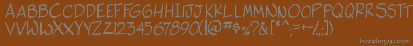 SideK-fontti – harmaat kirjasimet ruskealla taustalla