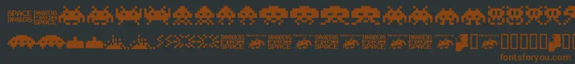 フォントInvaders.From.Space.Fontvir.Us – 黒い背景に茶色のフォント