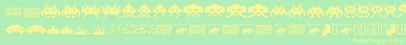 Шрифт Invaders.From.Space.Fontvir.Us – жёлтые шрифты на зелёном фоне