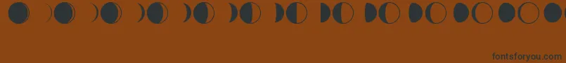 MoonPhasesRegular Font – Black Fonts on Brown Background