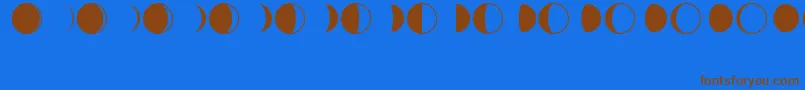 Czcionka MoonPhasesRegular – brązowe czcionki na niebieskim tle
