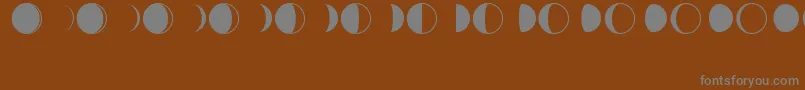 MoonPhasesRegular Font – Gray Fonts on Brown Background