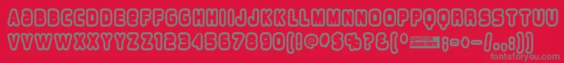 Fonte Overloadburn – fontes cinzas em um fundo vermelho
