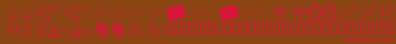 フォントKrChristmas2002Dings4 – 赤い文字が茶色の背景にあります。