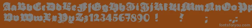 フォントGrobehand – 茶色の背景に灰色の文字