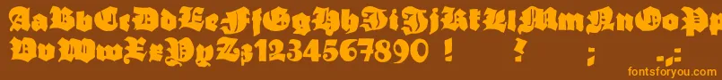 フォントGrobehand – オレンジ色の文字が茶色の背景にあります。