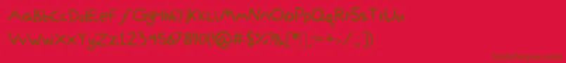 DamiWasHere-Schriftart – Braune Schriften auf rotem Hintergrund